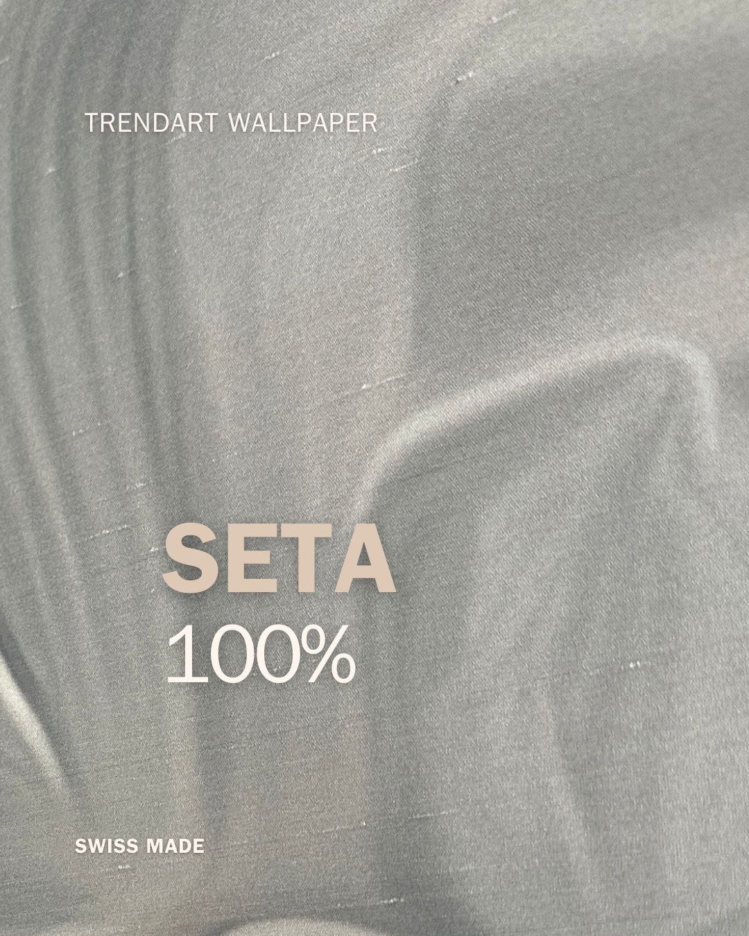 Fiore grigio sul materiale presentato come seta